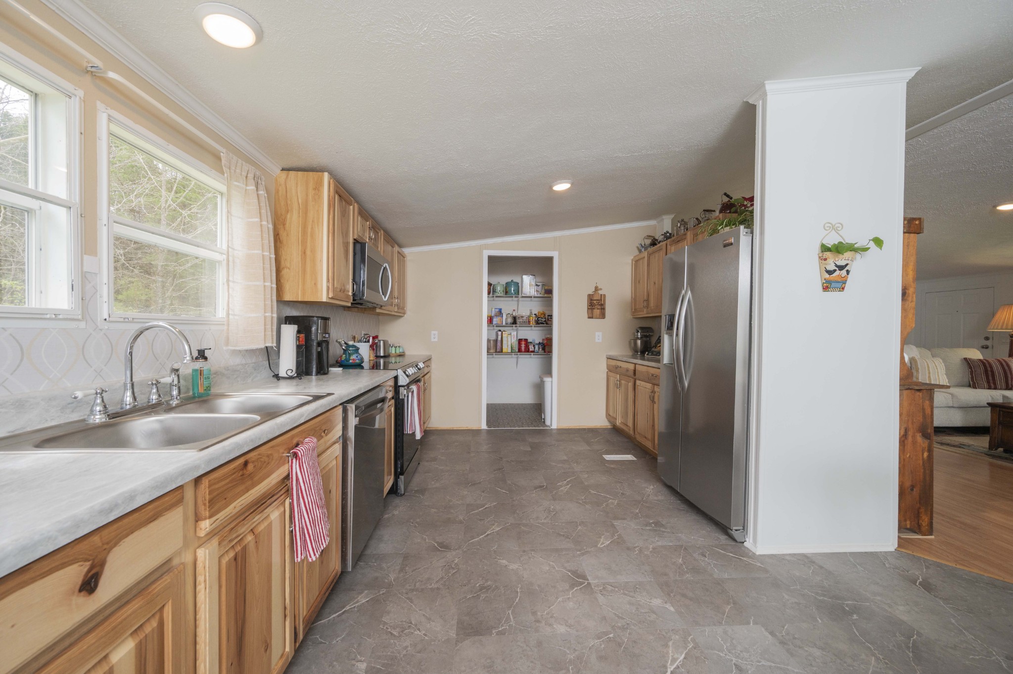 1822 Groveland Ridge Road Columbia, TN 38401 - Photo 12 of 48 a large kitchen with cabinets and stainless steel appliances