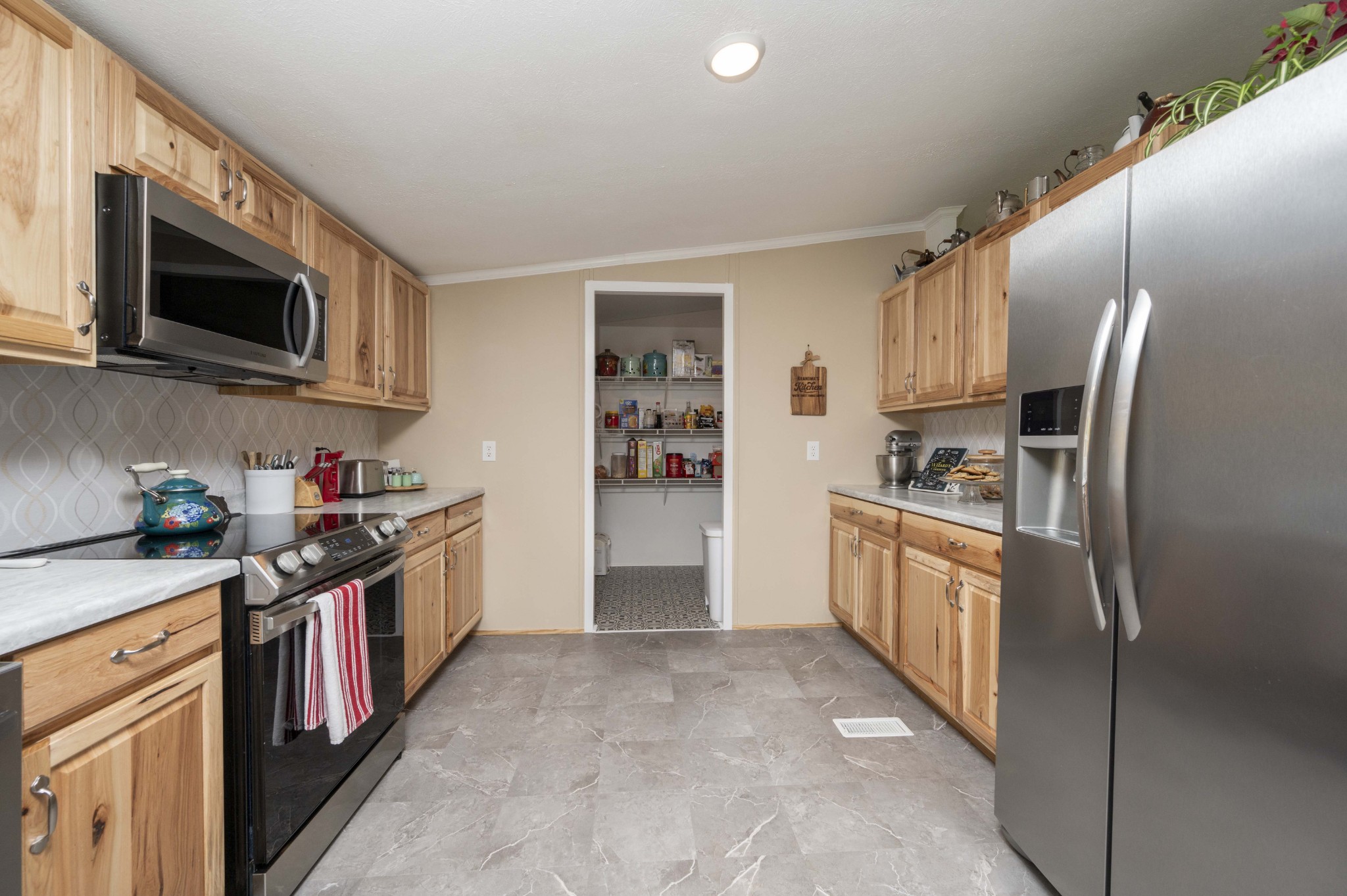 1822 Groveland Ridge Road Columbia, TN 38401 - Photo 13 of 48 a kitchen with stainless steel appliances granite countertop a refrigerator stove and sink