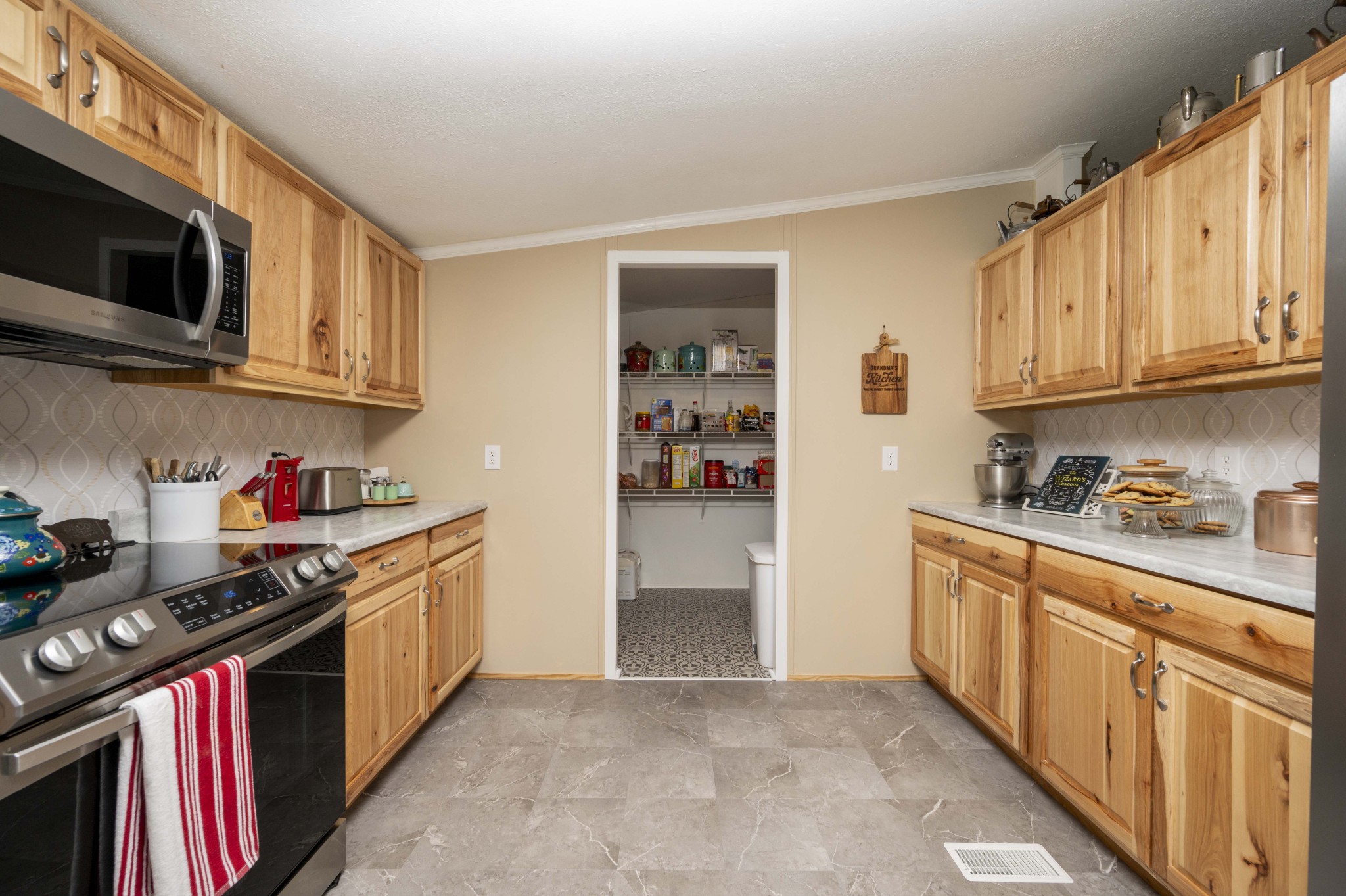 1822 Groveland Ridge Road Columbia, TN 38401 - Photo 14 of 48 a kitchen with stainless steel appliances granite countertop a stove and a refrigerator