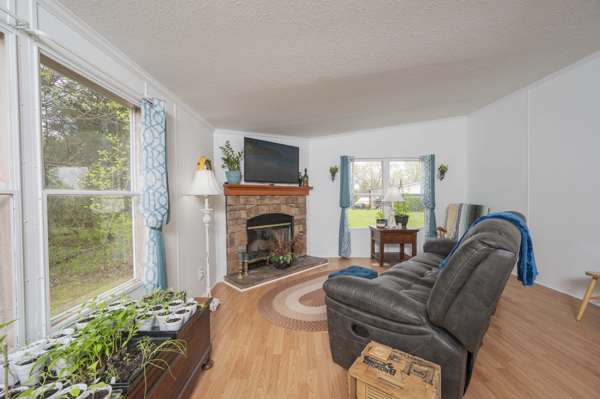 1822 Groveland Ridge Road Columbia, TN 38401 - Photo 36 of 48 a living room with furniture a flat screen tv and a fireplace