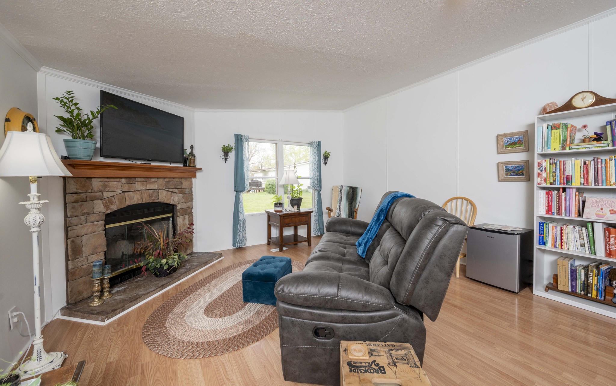 1822 Groveland Ridge Road Columbia, TN 38401 - Photo 38 of 48 a living room with furniture a flat screen tv and a fireplace
