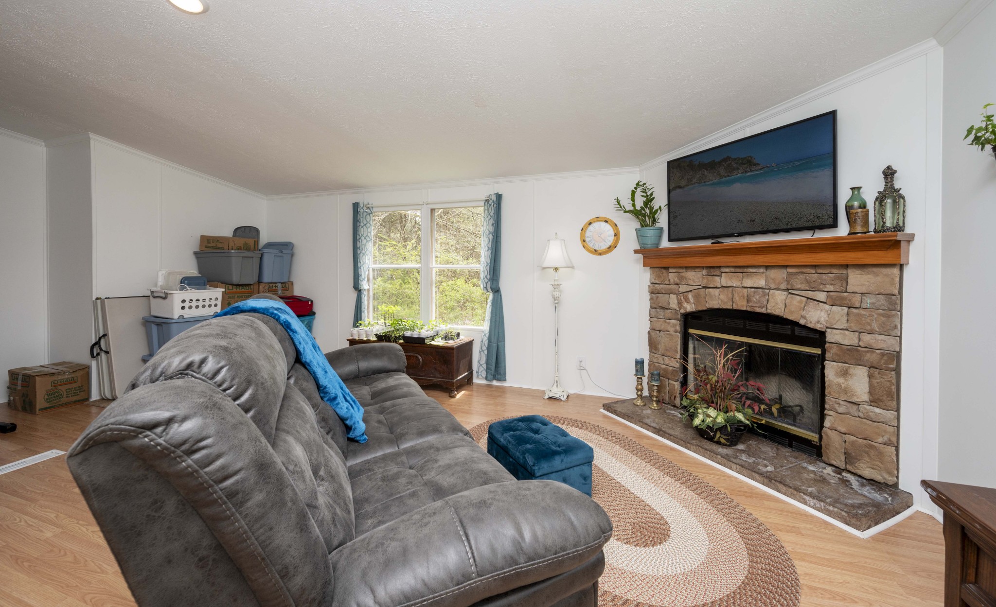 1822 Groveland Ridge Road Columbia, TN 38401 - Photo 39 of 48 a living room with furniture a flat screen tv and a fireplace