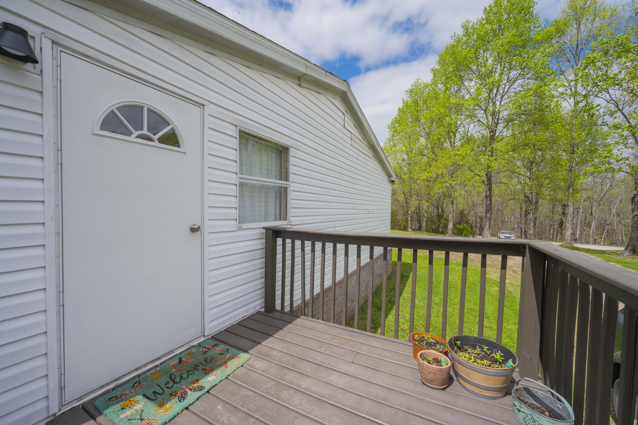 1822 Groveland Ridge Road Columbia, TN 38401 - Photo 41 of 48 a balcony with wooden floor table and chairs