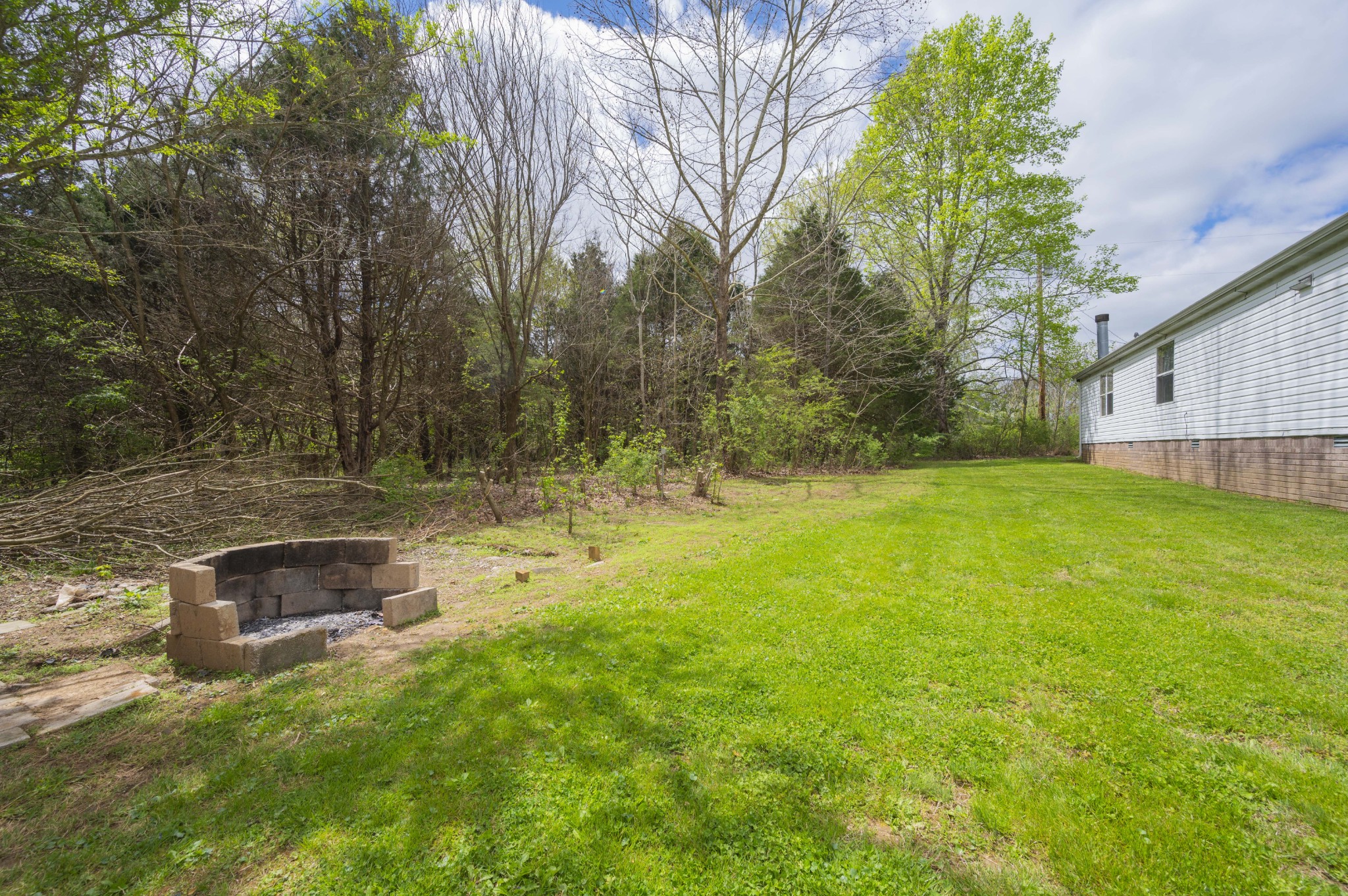 1822 Groveland Ridge Road Columbia, TN 38401 - Photo 42 of 48 a backyard of a house with a yard and seating space