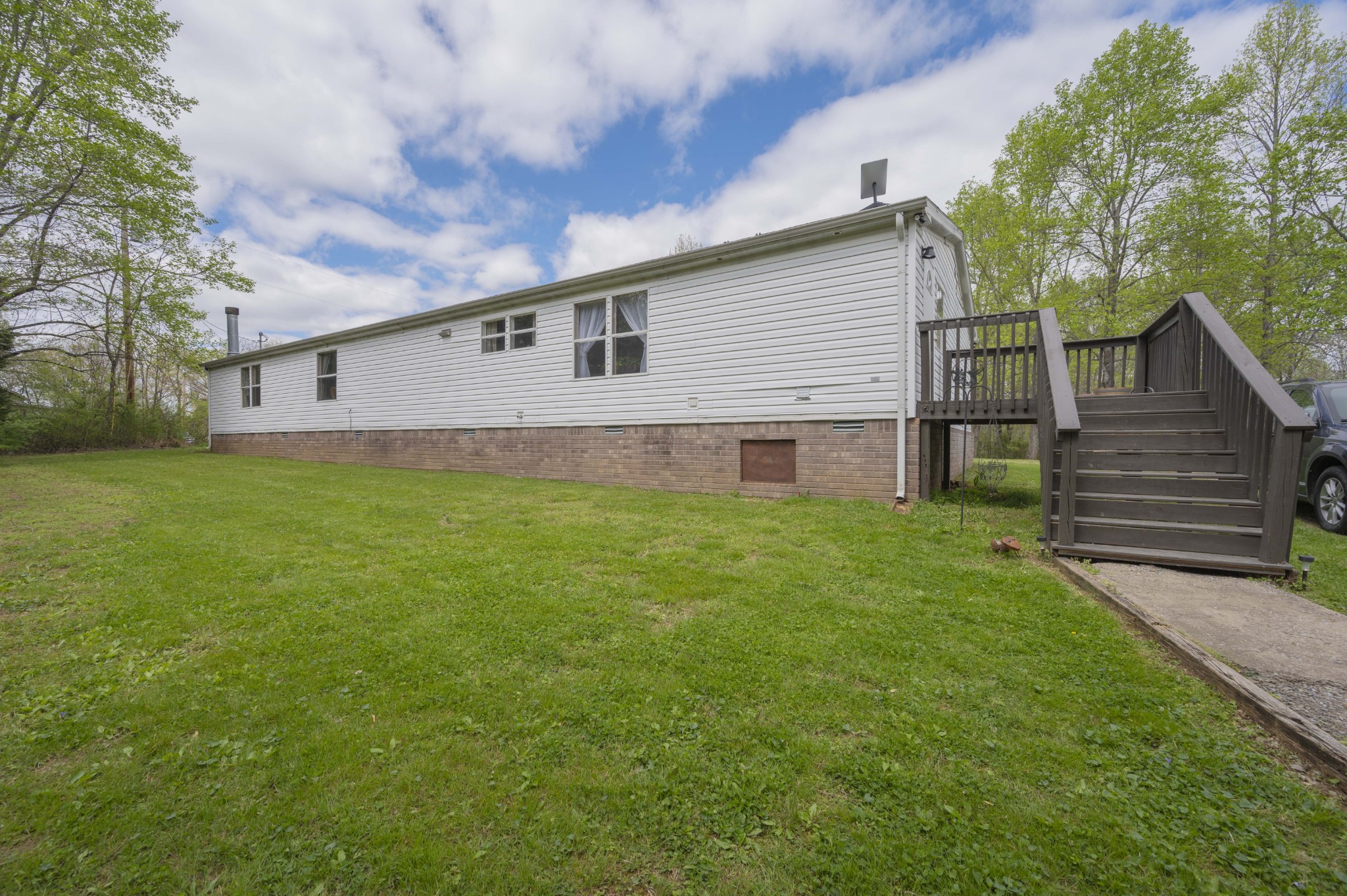 1822 Groveland Ridge Road Columbia, TN 38401 - Photo 44 of 48 a front view of house with yard and trees in the background