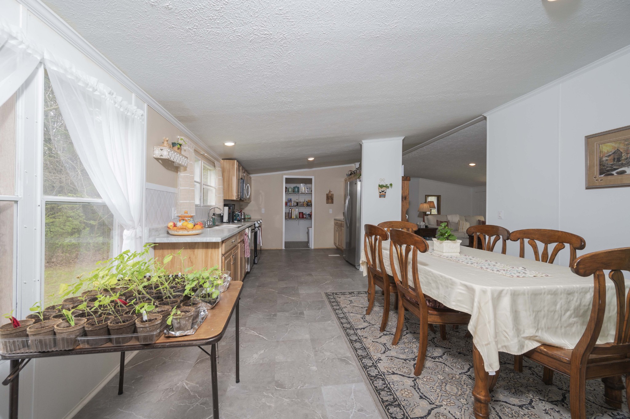 1822 Groveland Ridge Road Columbia, TN 38401 - Photo 10 of 48 a dining room with furniture and a floor to ceiling window