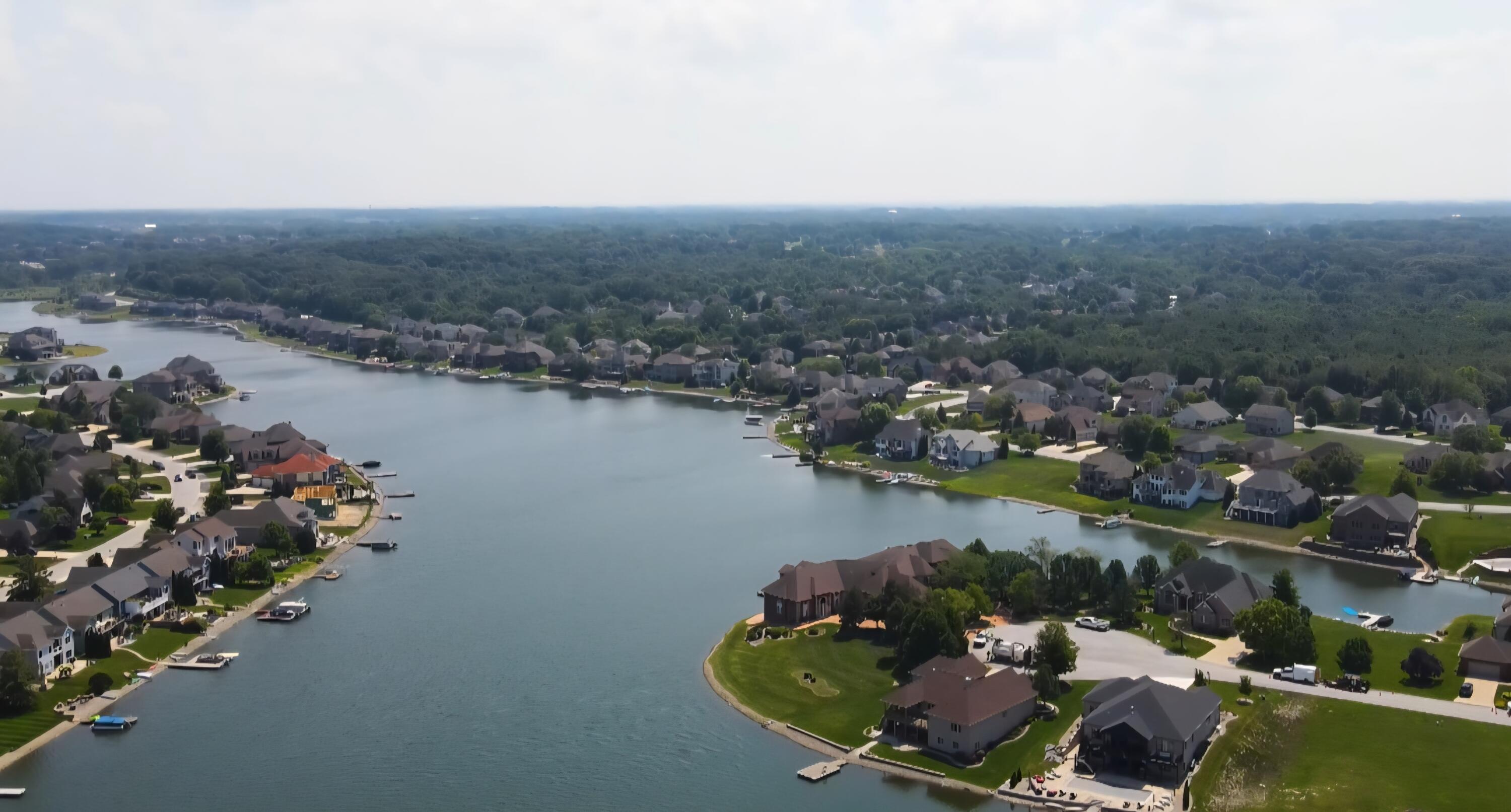 10820 Bridgewater Court Crown Point, IN 46307 - Photo 3 of 25 an aerial view of lake and residential houses with outdoor space