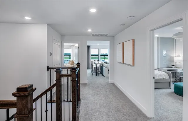a view of a livingroom with furniture and hardwood floor