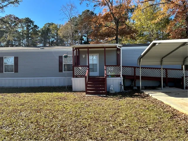 a house with swimming pool in front of it