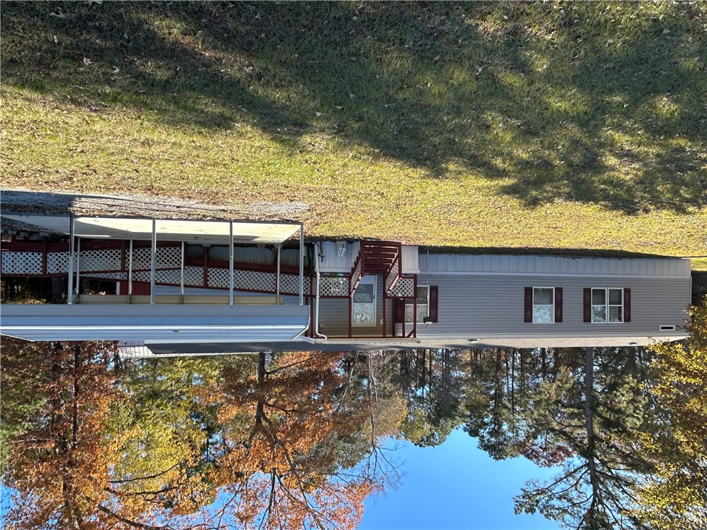 19730 County Road 2202D Tatum, TX 75691 - Photo 2 of 46 front view of a house with a yard