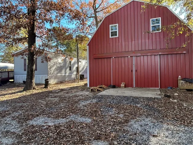 a view of a swimming pool with a yard