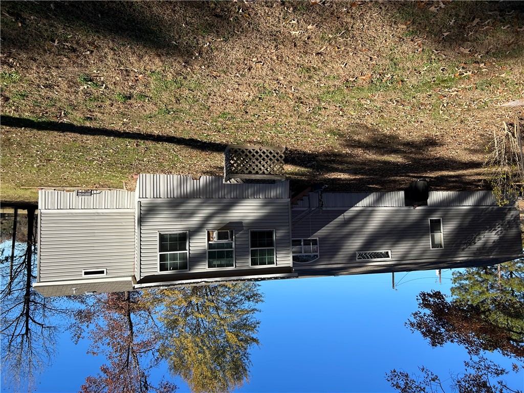 19730 County Road 2202D Tatum, TX 75691 - Photo 44 of 46 a view of a house with a yard
