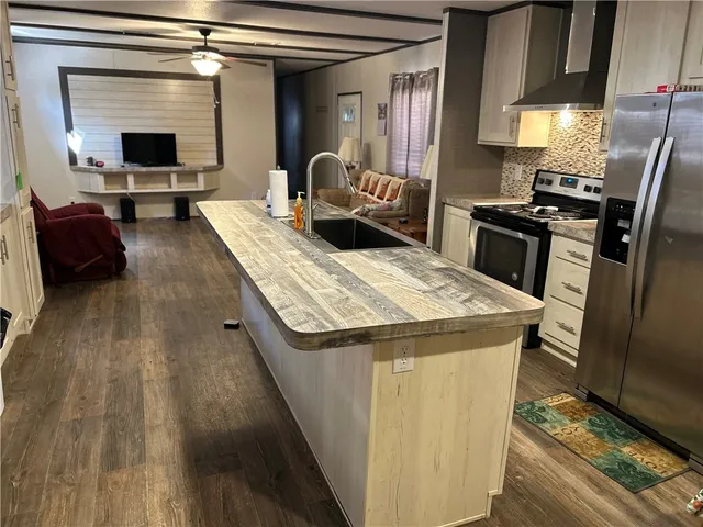 a bathroom with a glass shower door