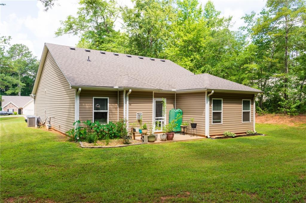 165 Pine Ridge Road Covington, GA 30016 - Photo 26 of 28 a front view of house with yard and green space