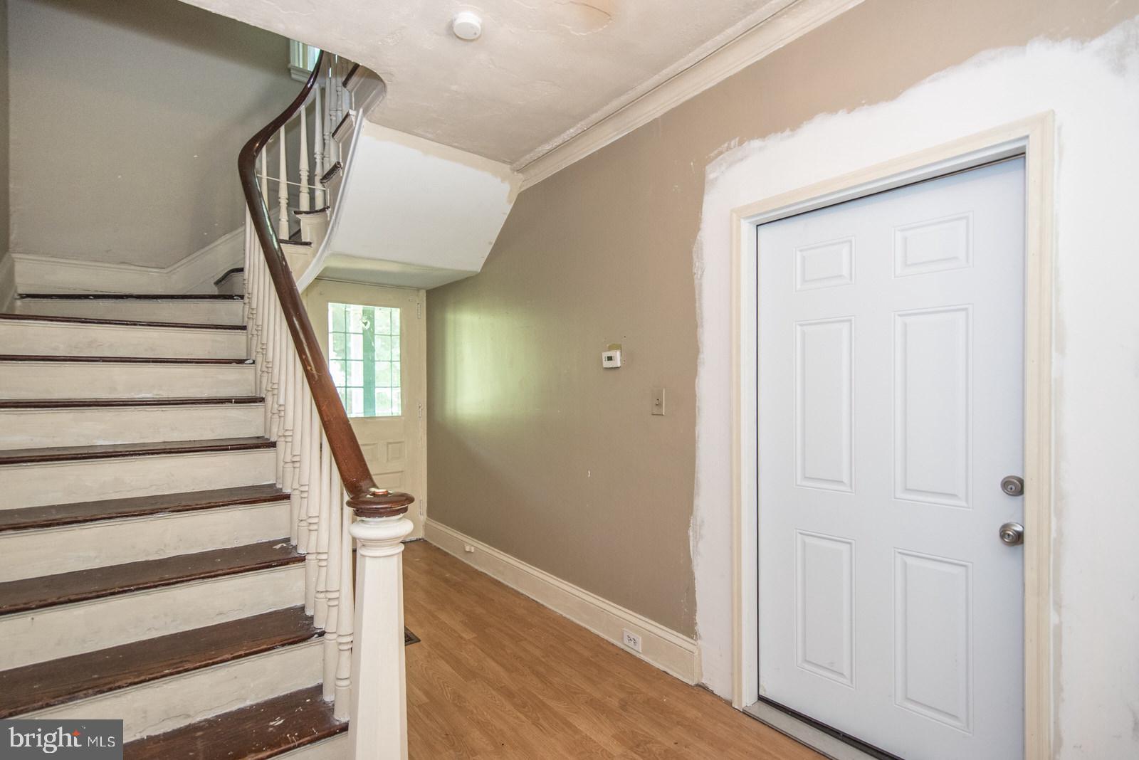 169 State Rd. Bensalem, PA 19020 - Photo 36 of 100 a view of front door with wooden floor and stairs