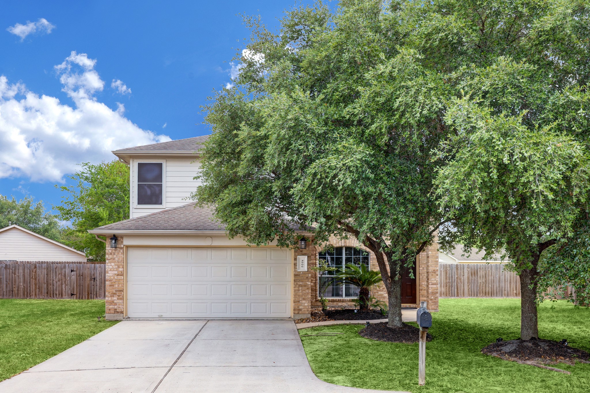 4906 Siros Isle Court Spring, TX 77389 - Photo 1 of 10 a front view of a house with a garden