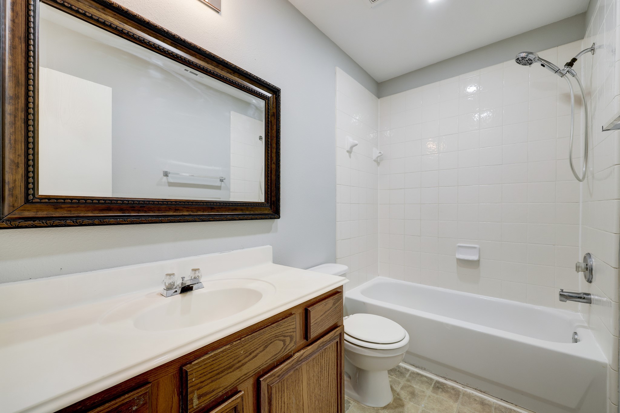 4906 Siros Isle Court Spring, TX 77389 - Photo 4 of 10 a bathroom with a sink a toilet and a bathtub