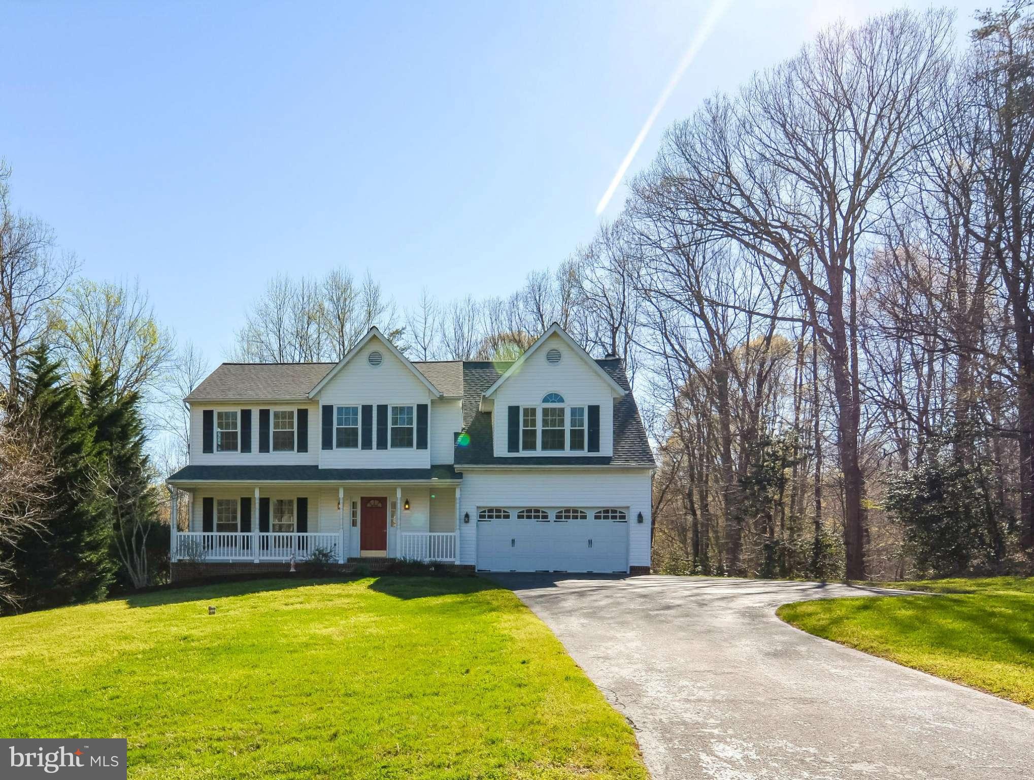 591 Small Reward Road Huntingtown, MD 20639 - Photo 2 of 30 a front view of a house with swimming pool