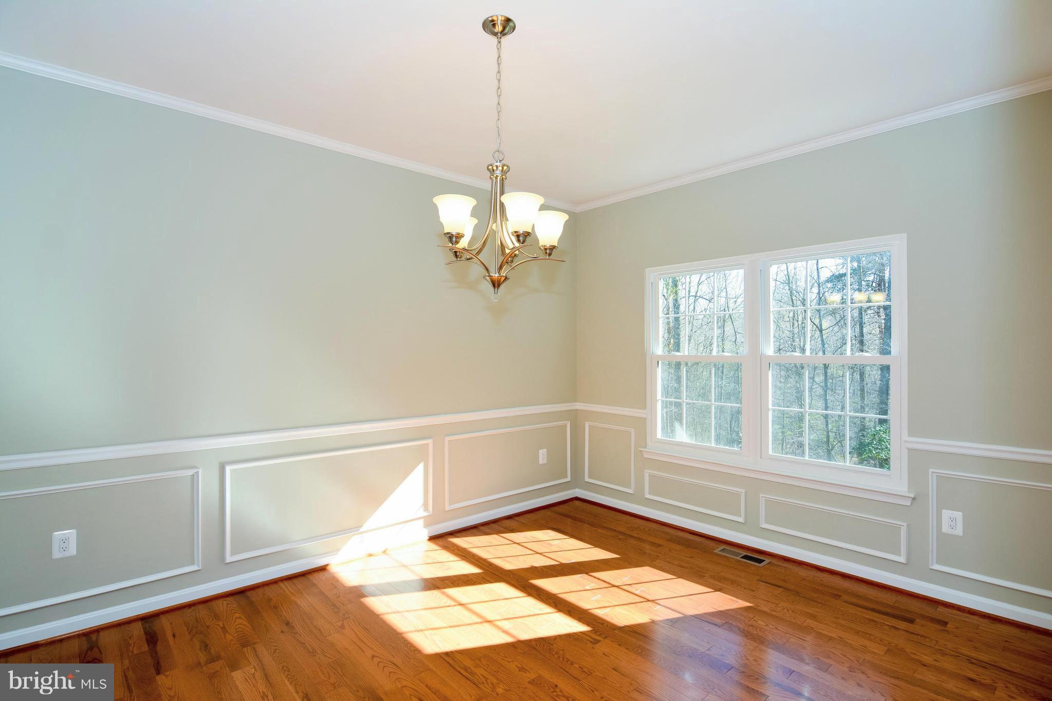 591 Small Reward Road Huntingtown, MD 20639 - Photo 14 of 30 a view of an empty room with a window and wooden floor