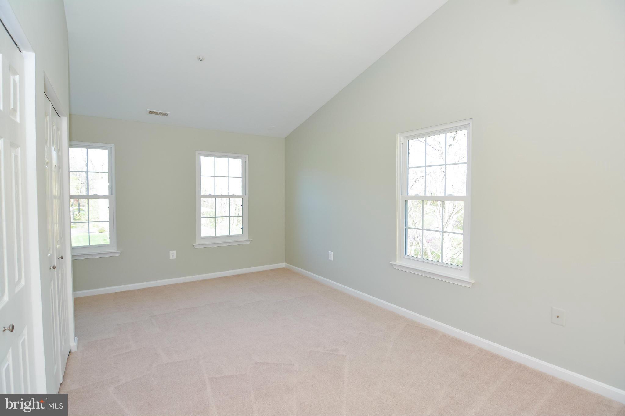 591 Small Reward Road Huntingtown, MD 20639 - Photo 19 of 30 an empty room with windows