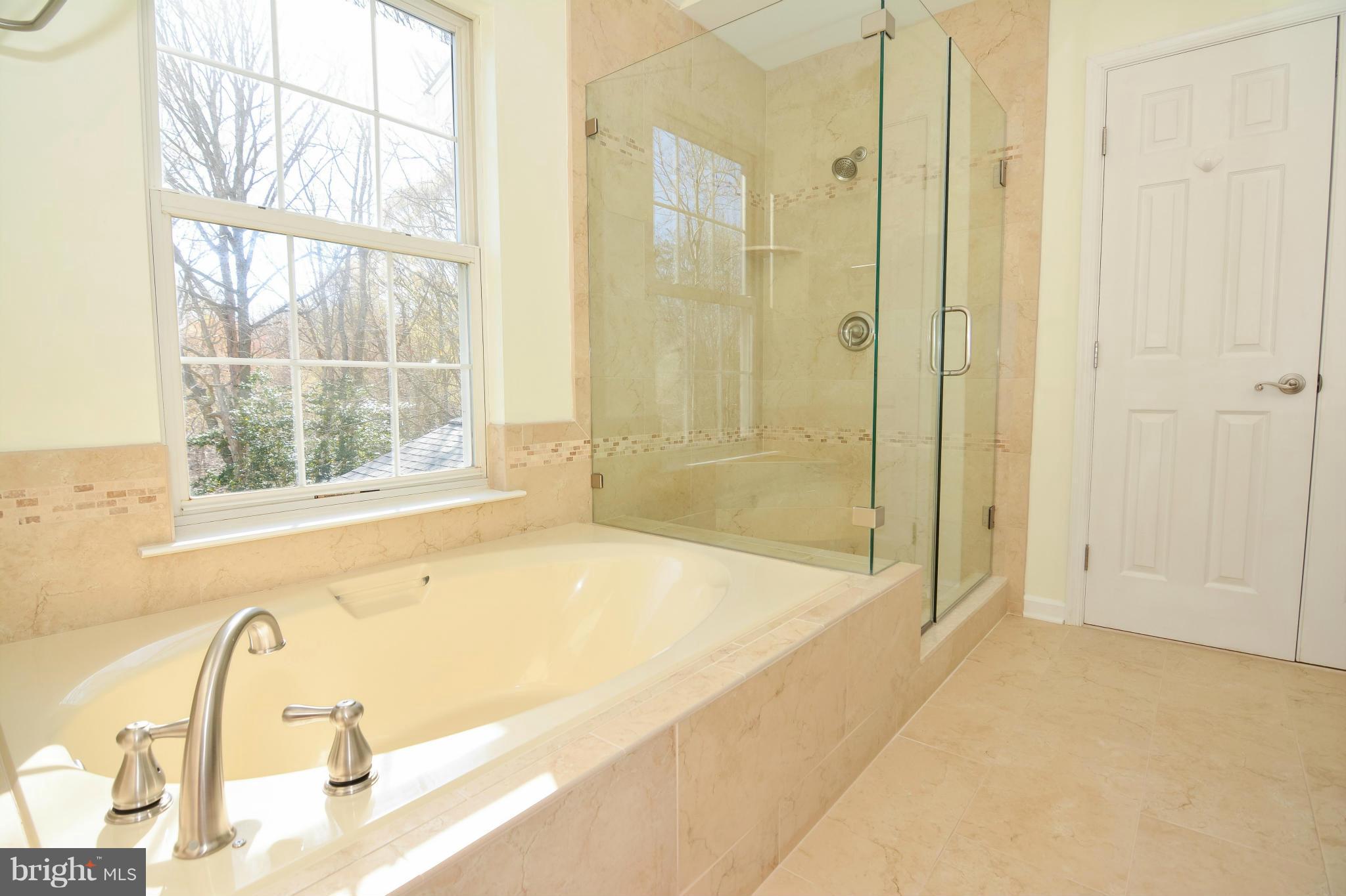 591 Small Reward Road Huntingtown, MD 20639 - Photo 21 of 30 a bathroom with a tub and shower
