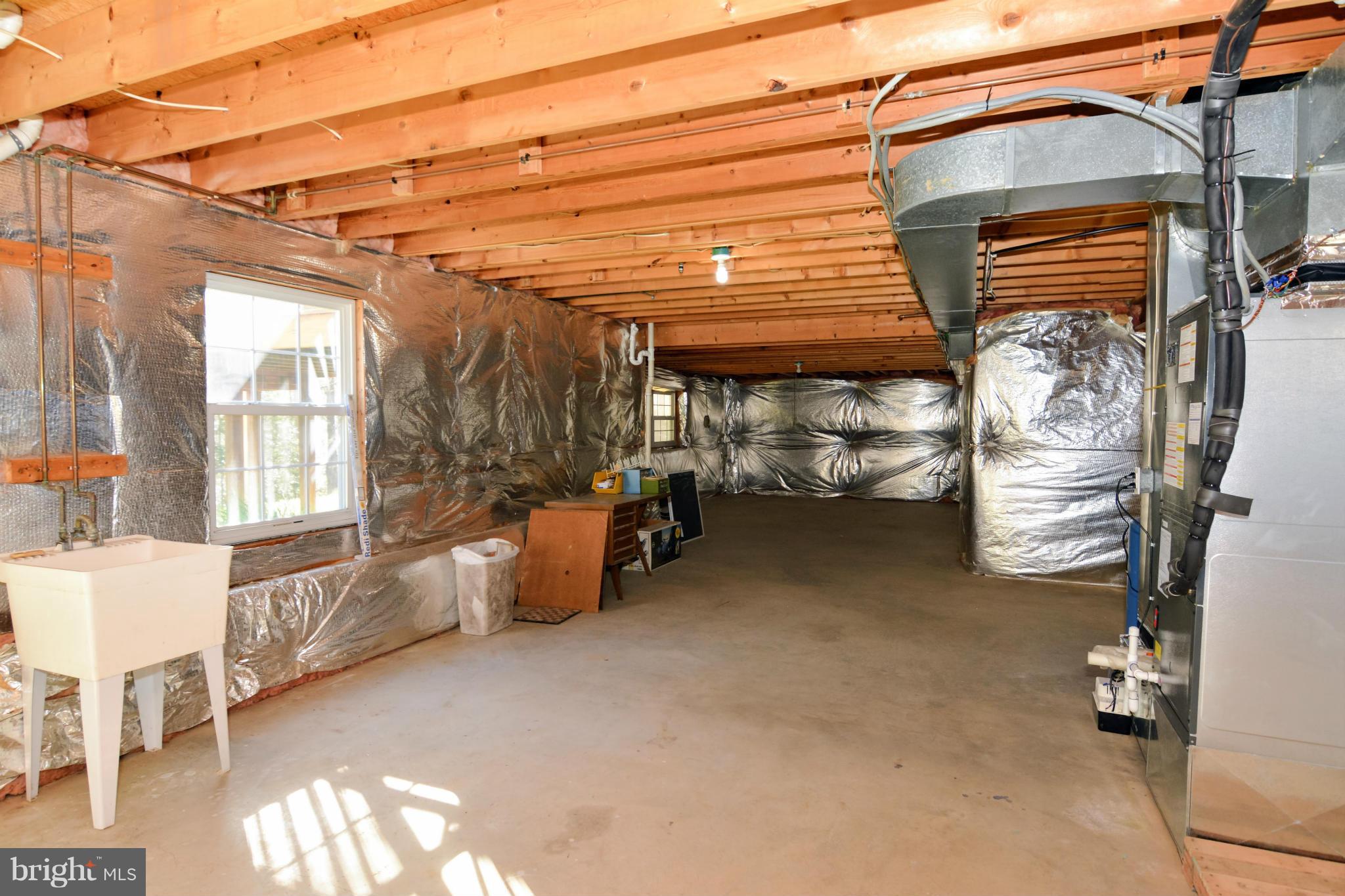 591 Small Reward Road Huntingtown, MD 20639 - Photo 29 of 30 a view of a storage room with water heater