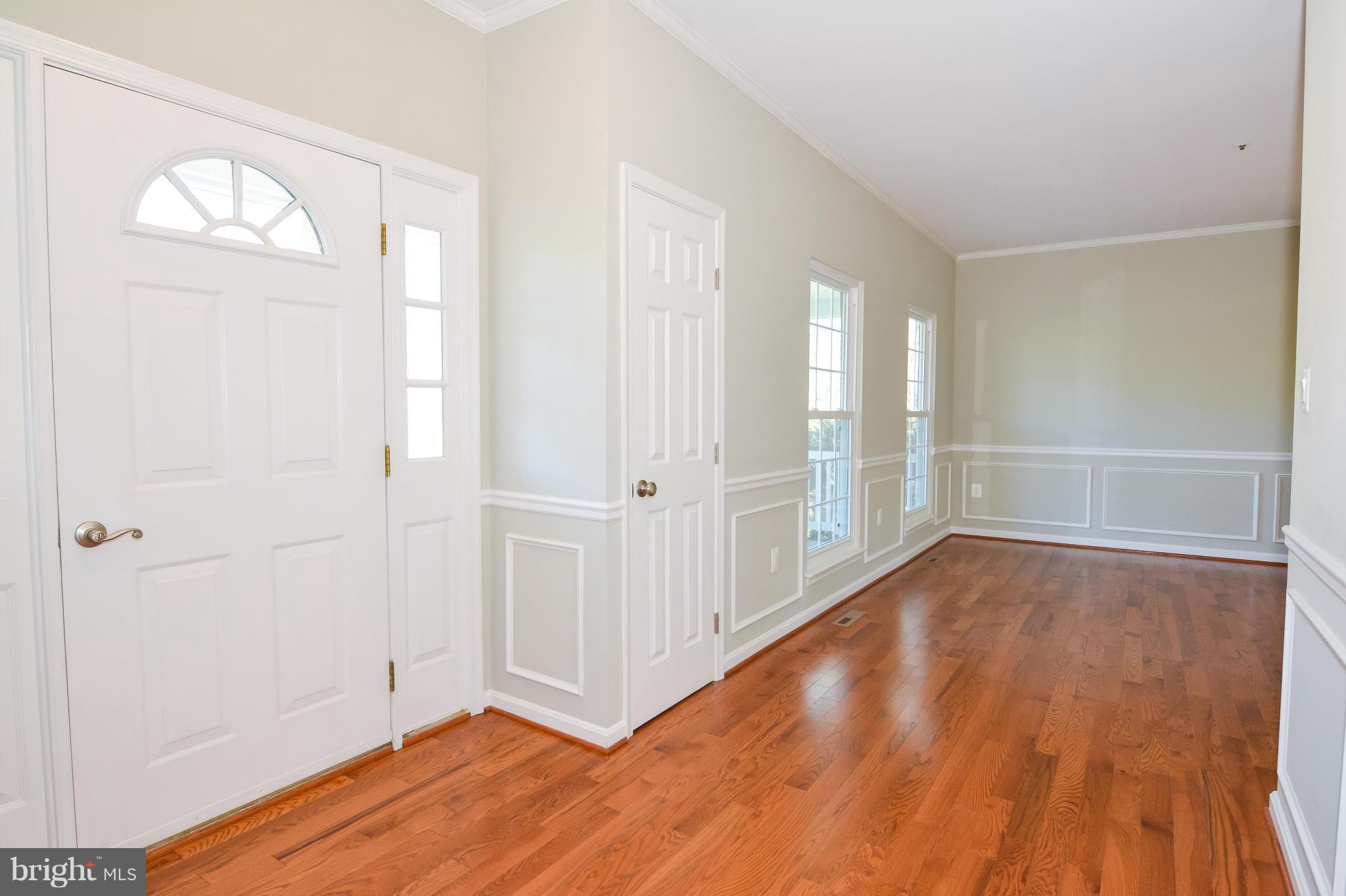 591 Small Reward Road Huntingtown, MD 20639 - Photo 6 of 30 wooden floor in an empty room