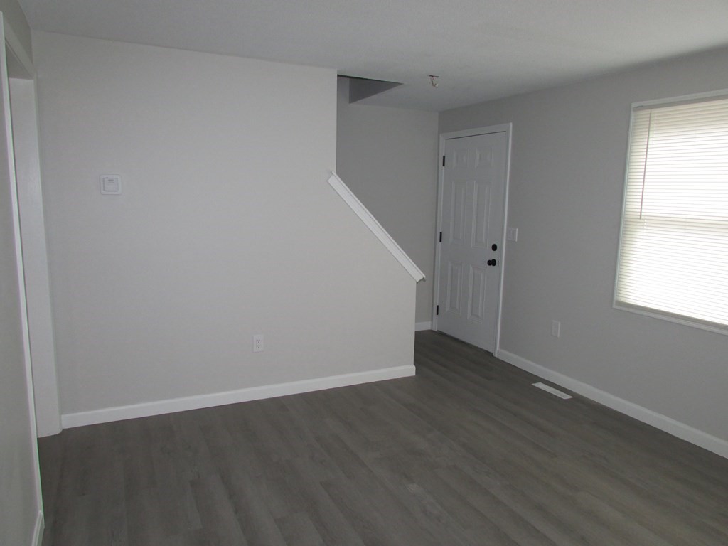 42-44 Wrentham Road Springfield, MA 01119 - Photo 16 of 31 an empty room with wooden floor and windows