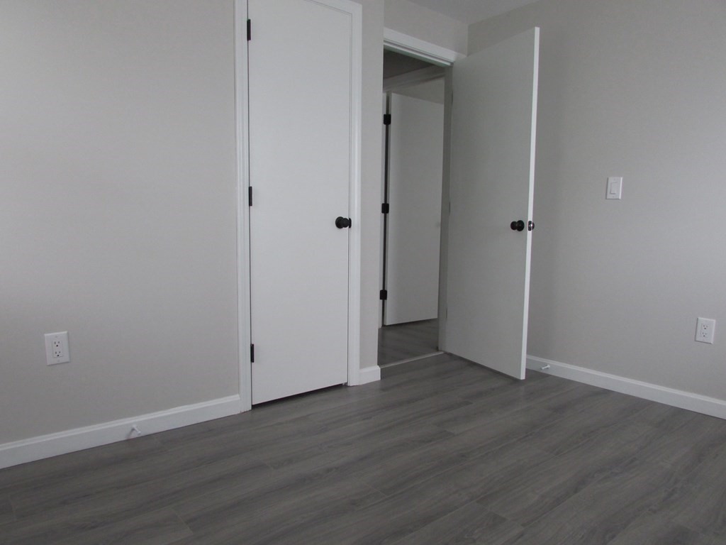 42-44 Wrentham Road Springfield, MA 01119 - Photo 23 of 31 a view of an empty room with wooden floor