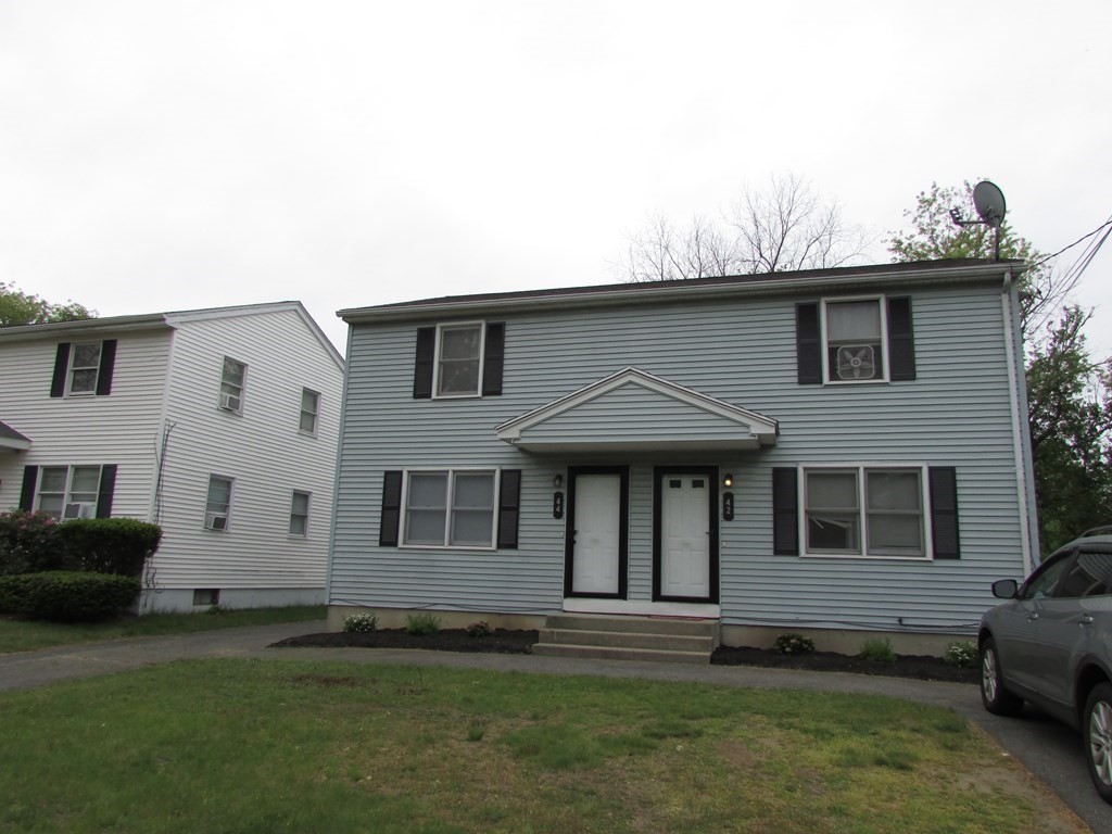 42-44 Wrentham Road Springfield, MA 01119 - Photo 3 of 31 a front view of a house with a garden