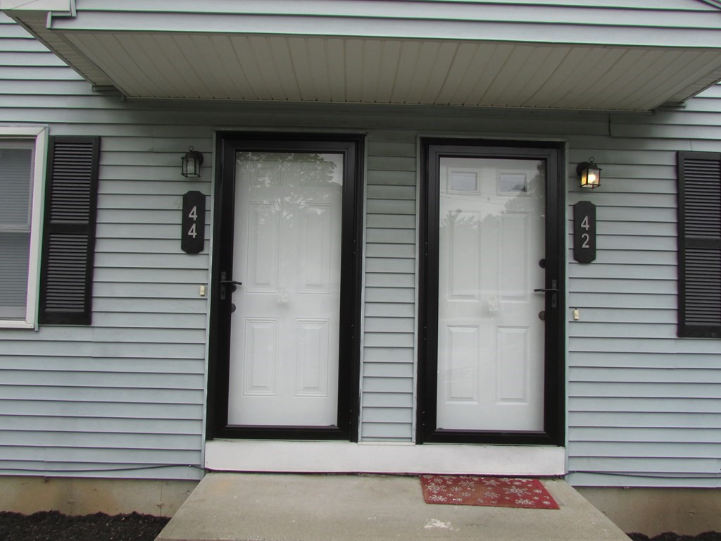42-44 Wrentham Road Springfield, MA 01119 - Photo 4 of 31 a view of a door and a window