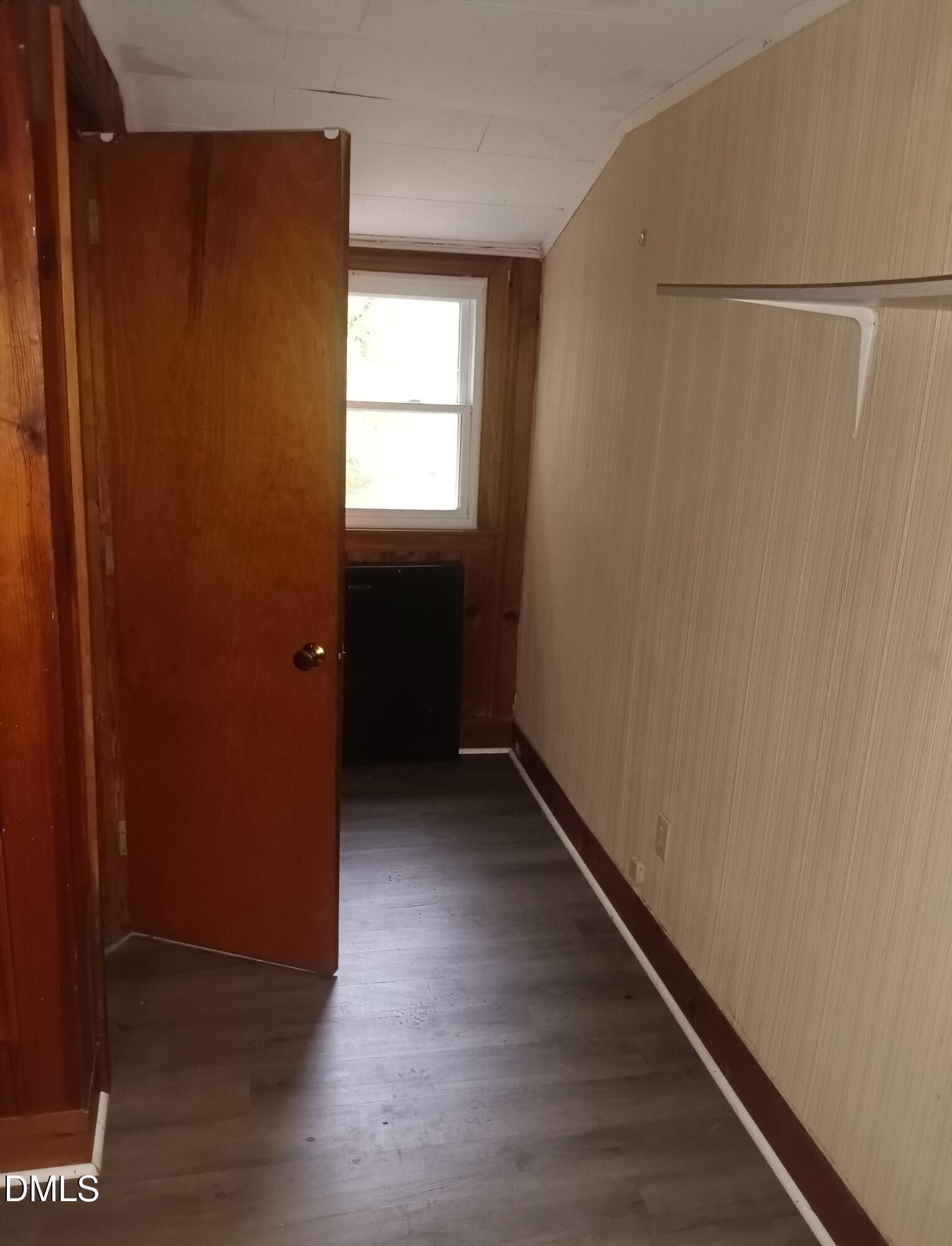 7856 Boston Road Roxboro, NC 27574 - Photo 14 of 18 a view of a hallway with wooden floor