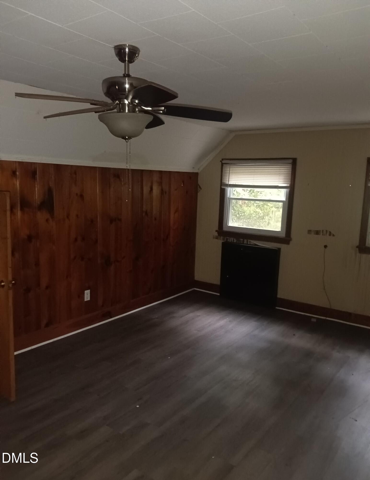 7856 Boston Road Roxboro, NC 27574 - Photo 15 of 18 an empty room with wooden floor painted walls