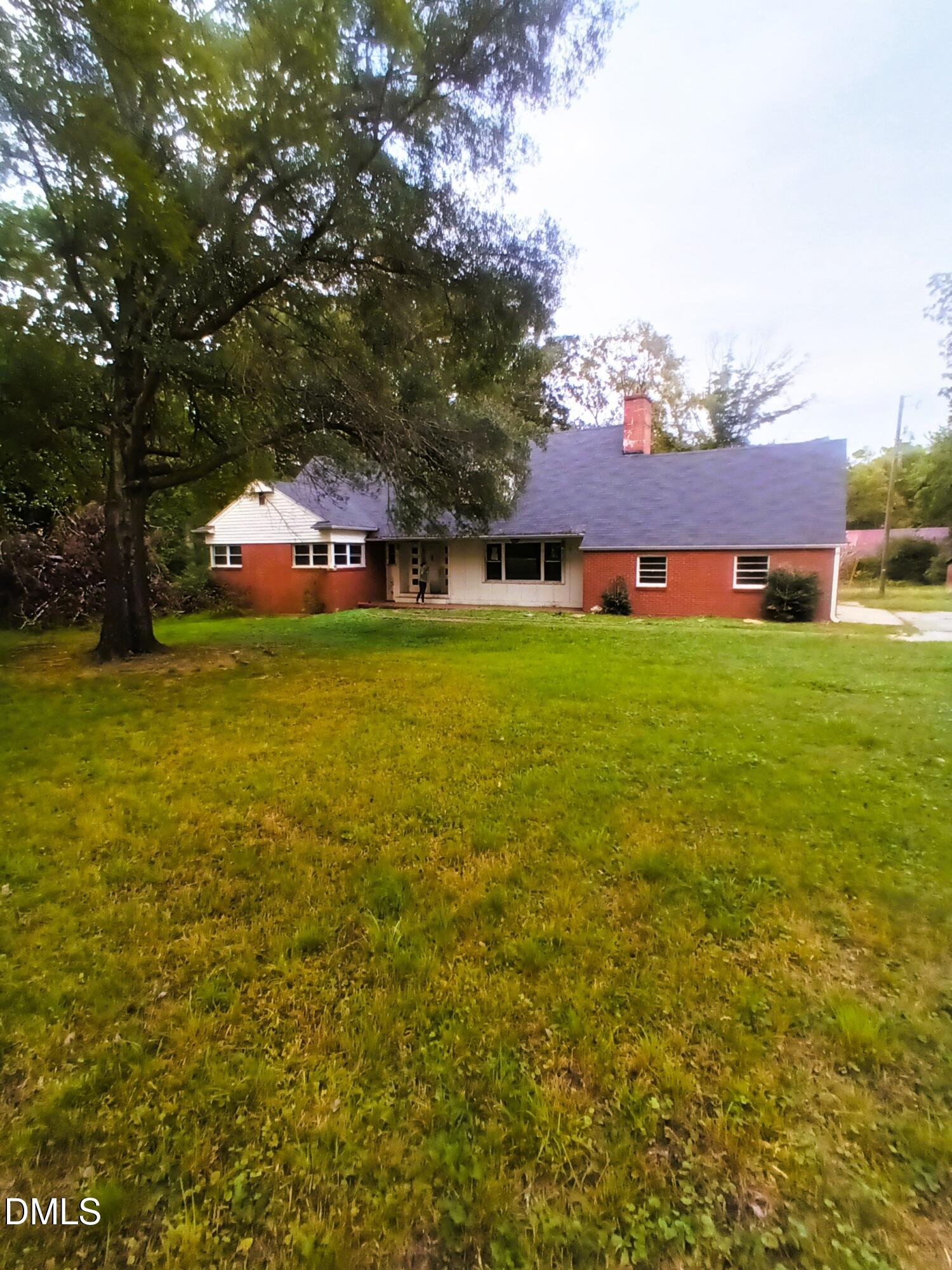 7856 Boston Road Roxboro, NC 27574 - Photo 2 of 18 a car parked in front of a house and a yard
