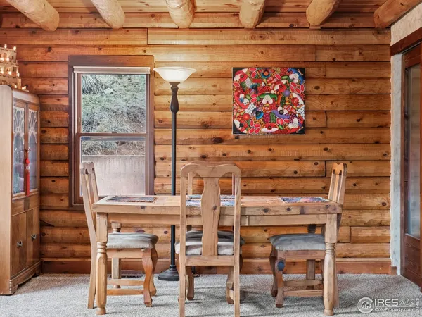 a view of a room with chairs and a table