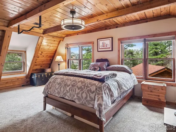 a bed sitting in a room next to a window