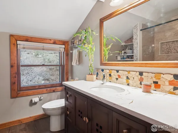 a bathroom with a sink and a large mirror