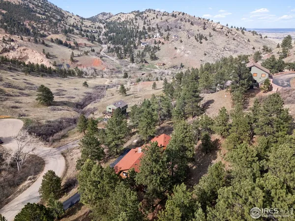 a aerial view of a house with a yard