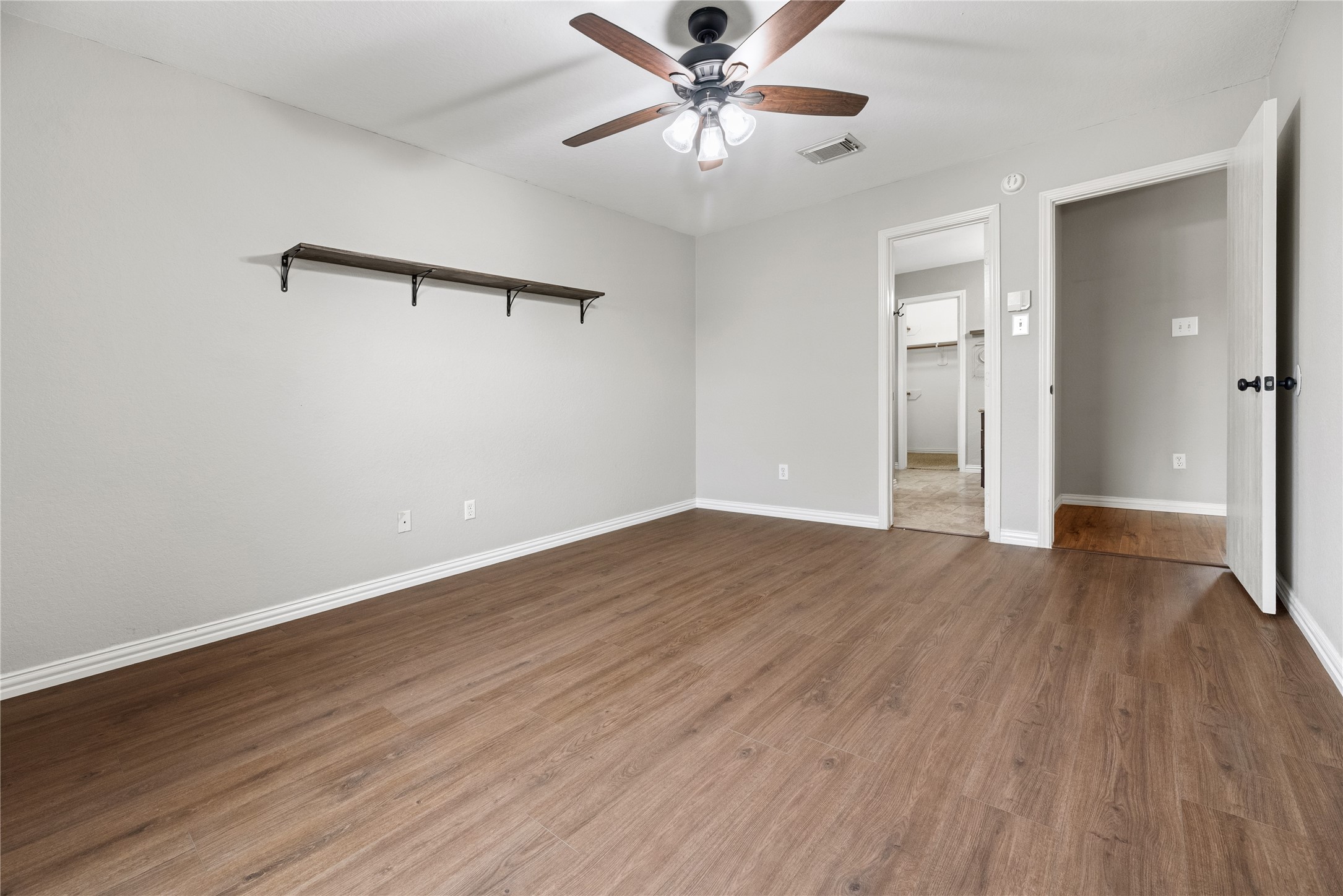 24006 Lazy Kay Lane Hockley, TX 77447 - Photo 11 of 21 The primary bedroom has an en-suite bathroom and a large walk-in closet.