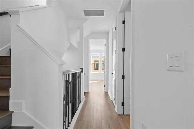 a bathroom with a double vanity sink a mirror and shower