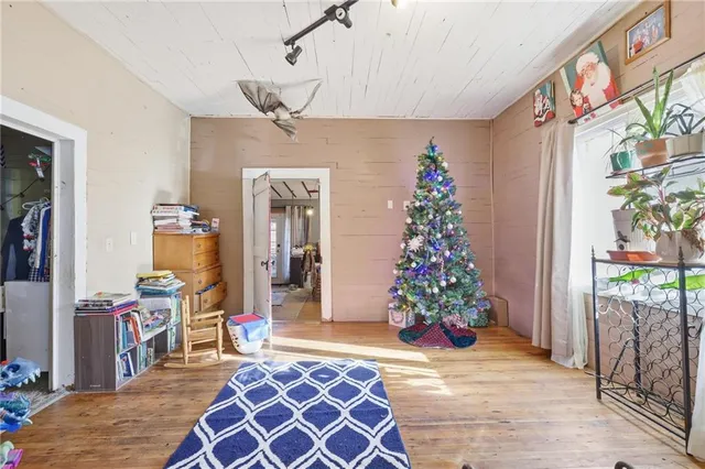 a bathroom with a sink and mirror with shower curtain