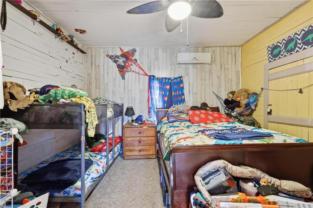 415 Tapley Road Villa Rica, GA 30180 - Photo 22 of 25 a room with furniture and a flat screen tv