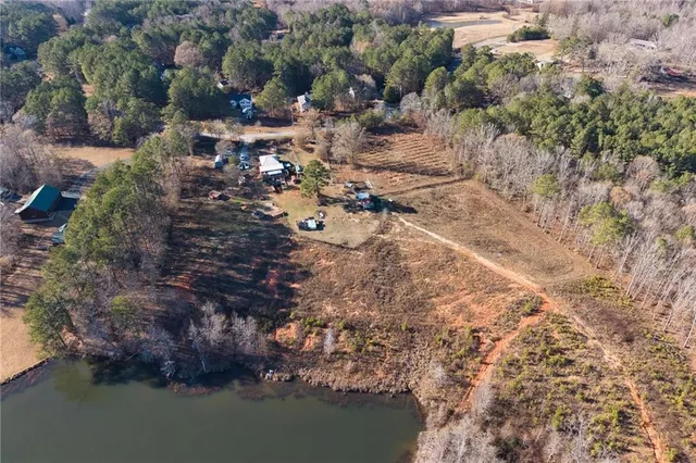 an aerial view of house with yard
