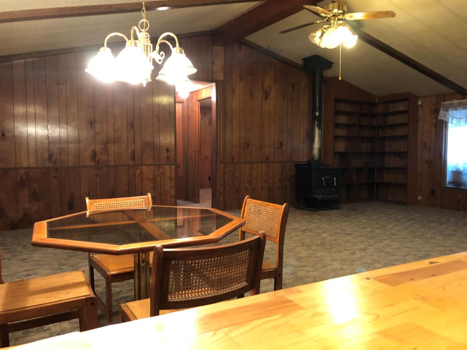 6226 East Evans Creek Road, Unit 15 Rogue River, OR 97537 - Photo 12 of 30 a room with table and chairs
