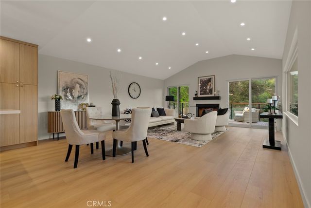 a view of a balcony with couches and wooden floor