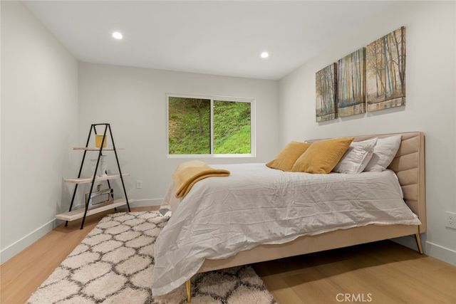 a aerial view of a house with swimming pool next to a yard