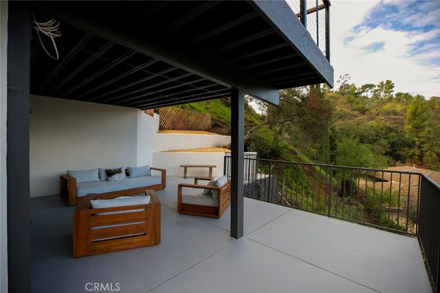 a view of a porch with a floor to ceiling window