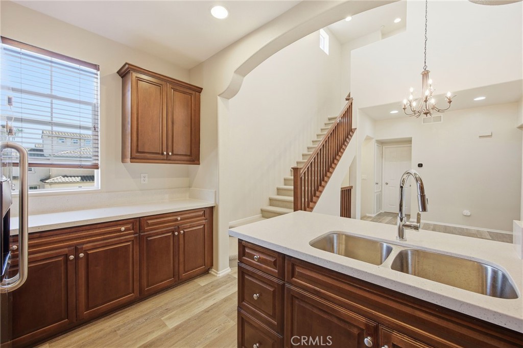 3603 Jetty Carlsbad, CA 92010 - Photo 17 of 43 a kitchen with a sink and cabinets