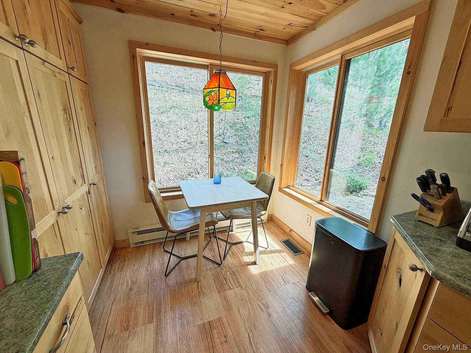 5120 Peas Eddy Road Hancock, NY 13783 - Photo 20 of 37 a view of a dining room with furniture window and wooden floor