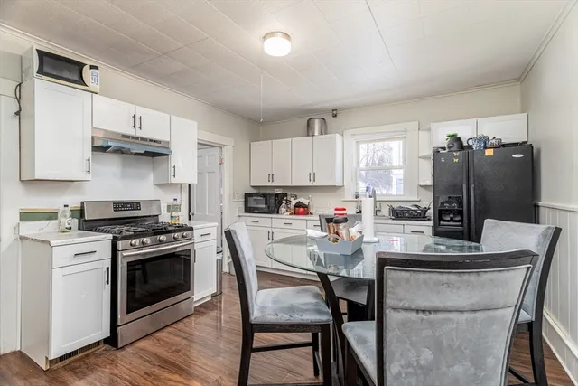 a kitchen with stainless steel appliances a stove a sink island and a refrigerator